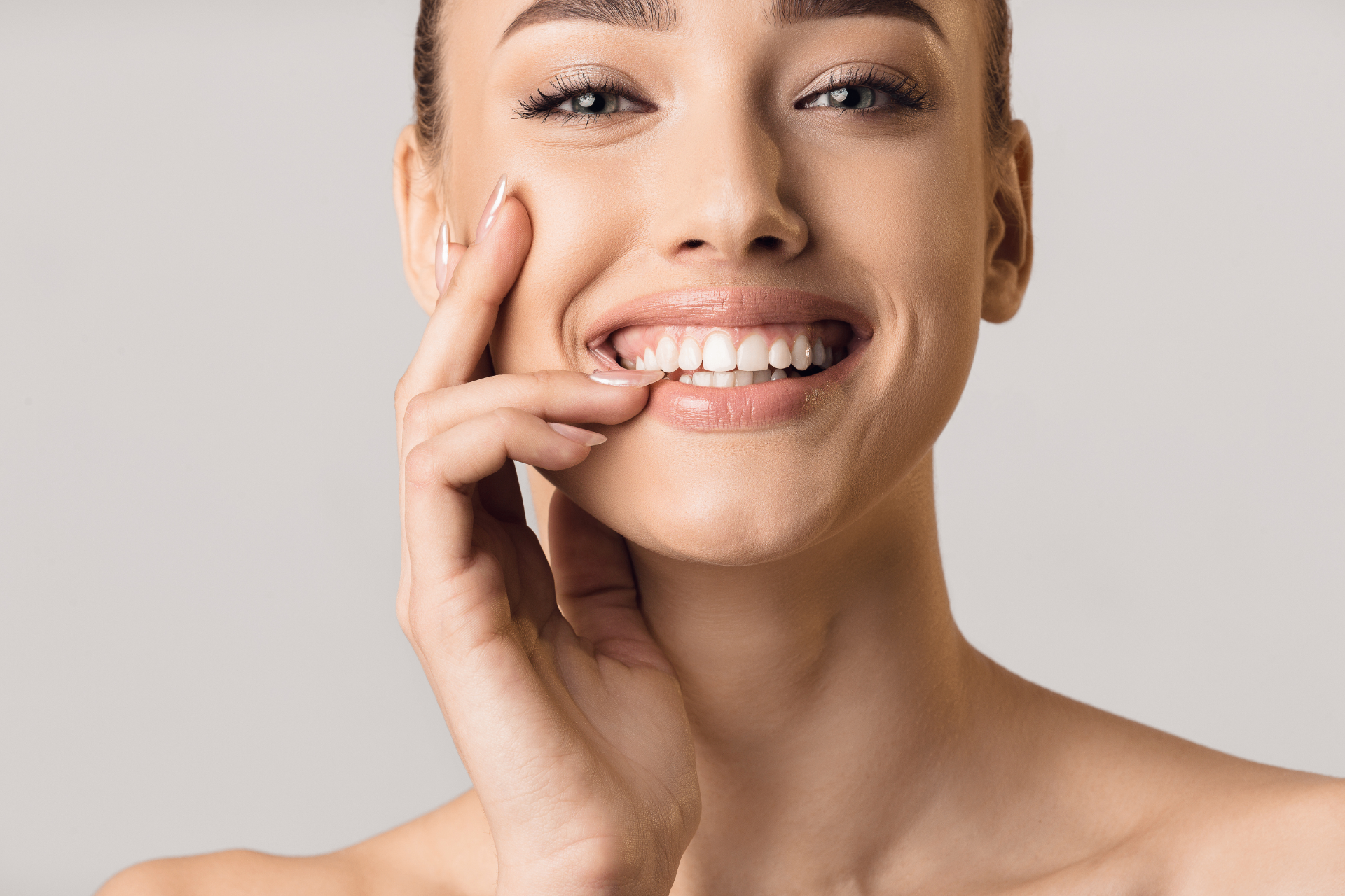 Bright smiling patient after professional teeth whitening
