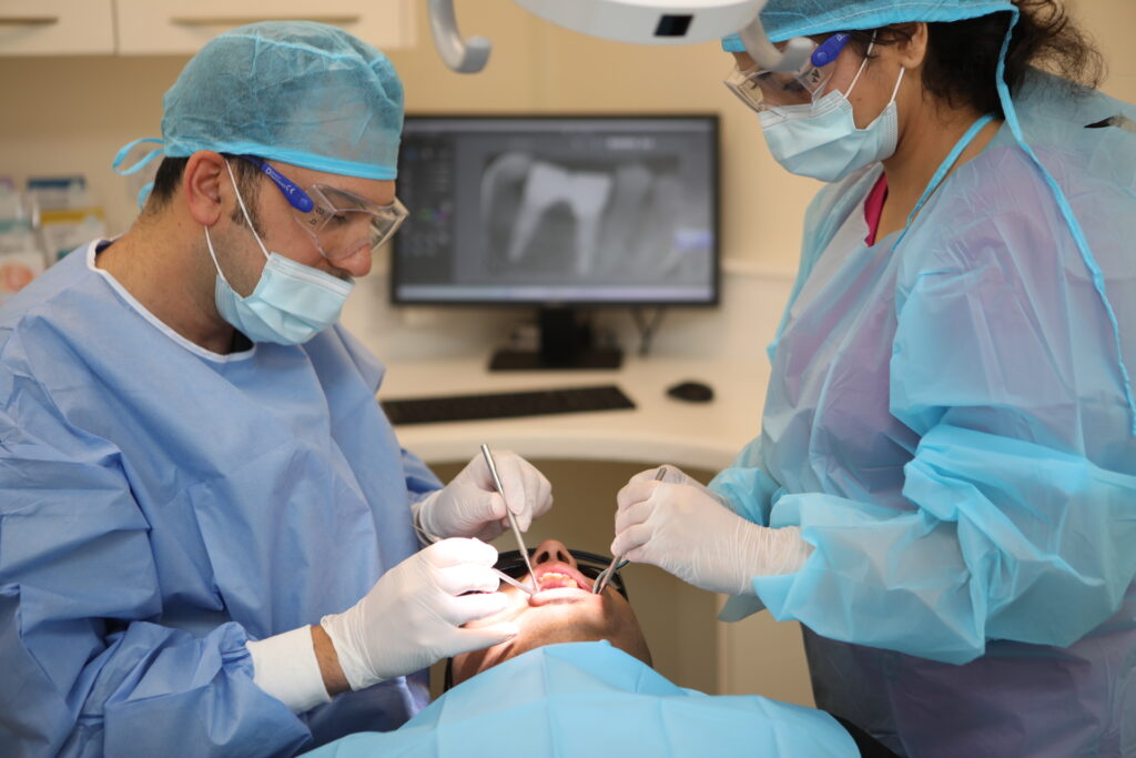 Implant surgery being performed at Woodbridge Hill Dental Practice in Guildford
